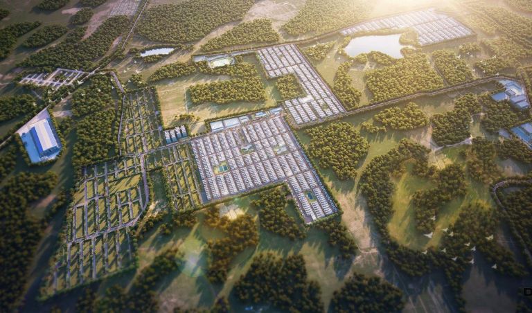 Residential township in Hyderabad with lush green lawns and tree‑lined pathways