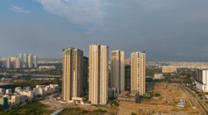 Wide-angle view of modern residential towers along Hitech City Kondapur corridor — buy property Hyderabad for rental yield
